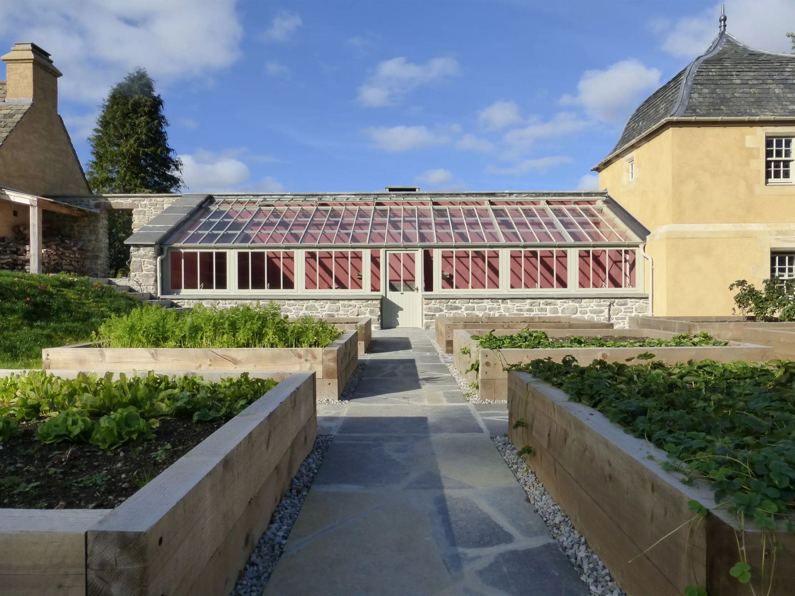 Victorian mono-pitch lean-to greenhouse into two corners